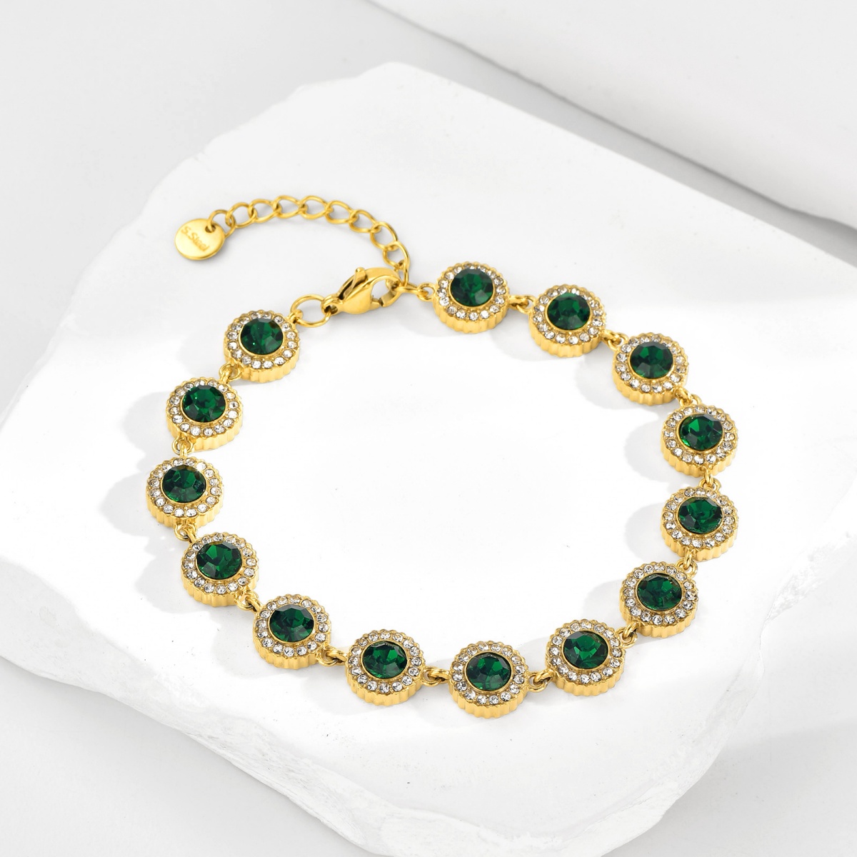 Gold Tennis Bracelet detail showing green, pink, blue, red and multicolor crystal options