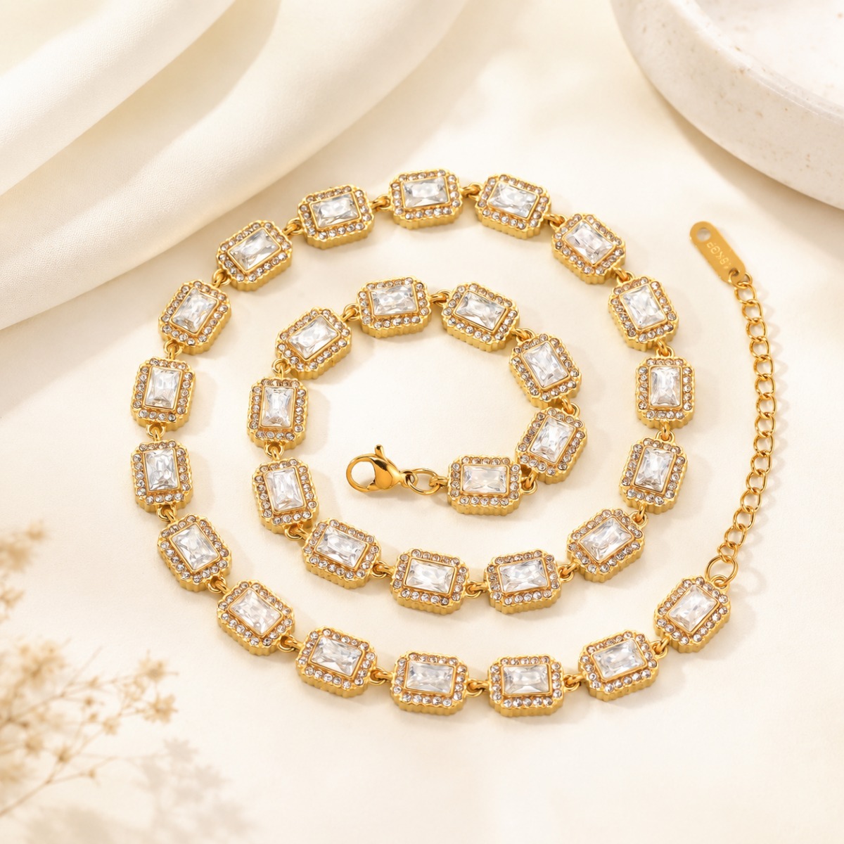 Rectangular crystal tennis necklace displayed in a light jewelry scene