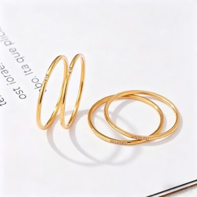 Minimalist stainless steel ring set with gold plating and crystal accents