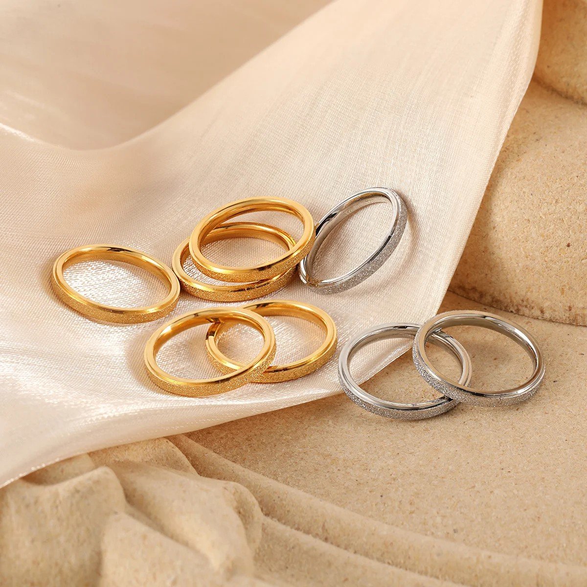 Gold stainless steel textured ring set with matte surface finish