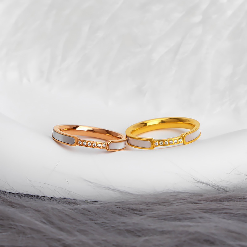 Gold and rose gold stainless steel enamel crystal band rings with white enamel details