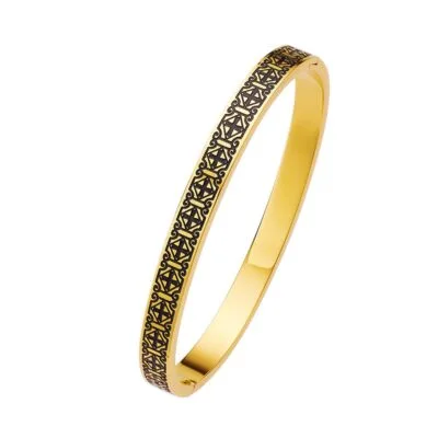 gold patterned bangle on white background