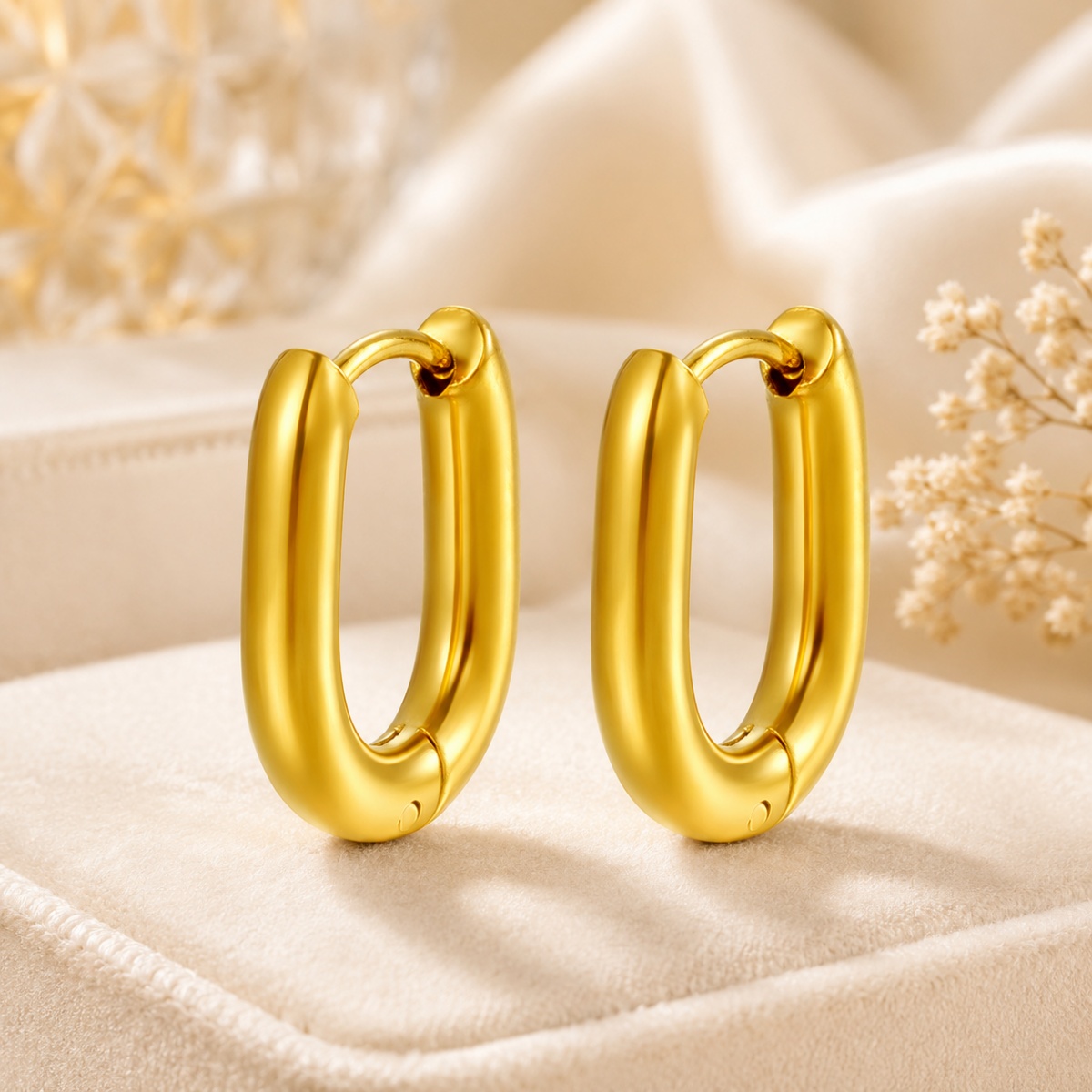 gold chunky hoop earrings on white background