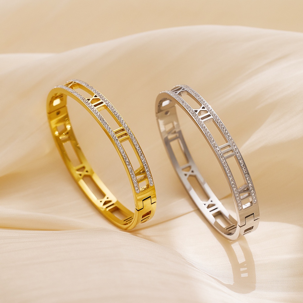 gold crystal roman bangle on white background