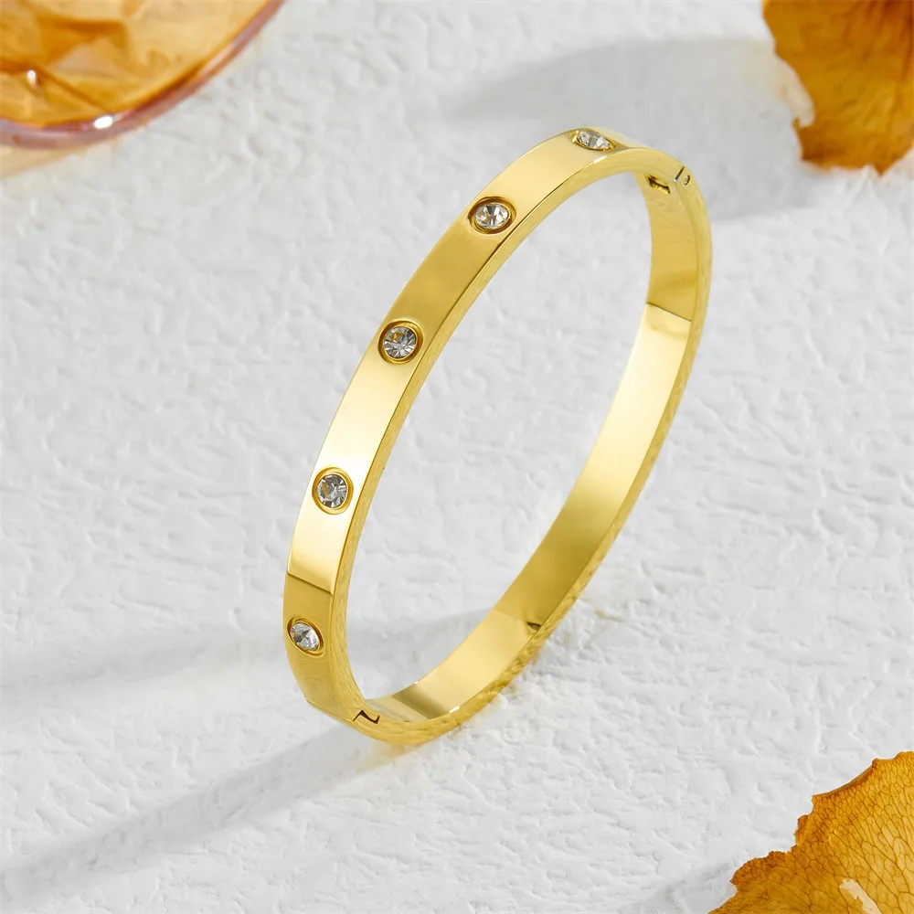 gold crystal stud bangle on white background