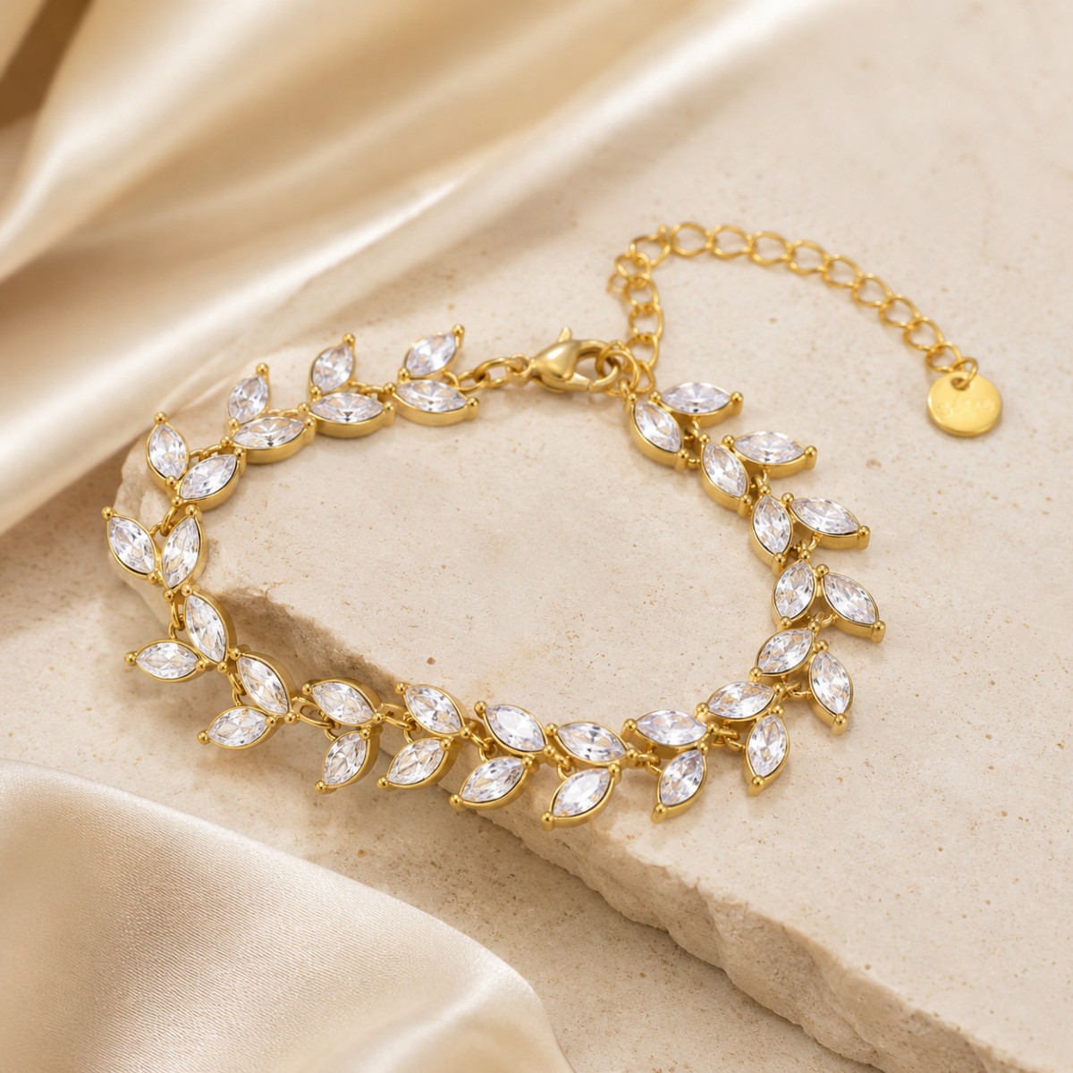 Gold Crystal Leaf Bracelet displayed in a jewelry setting