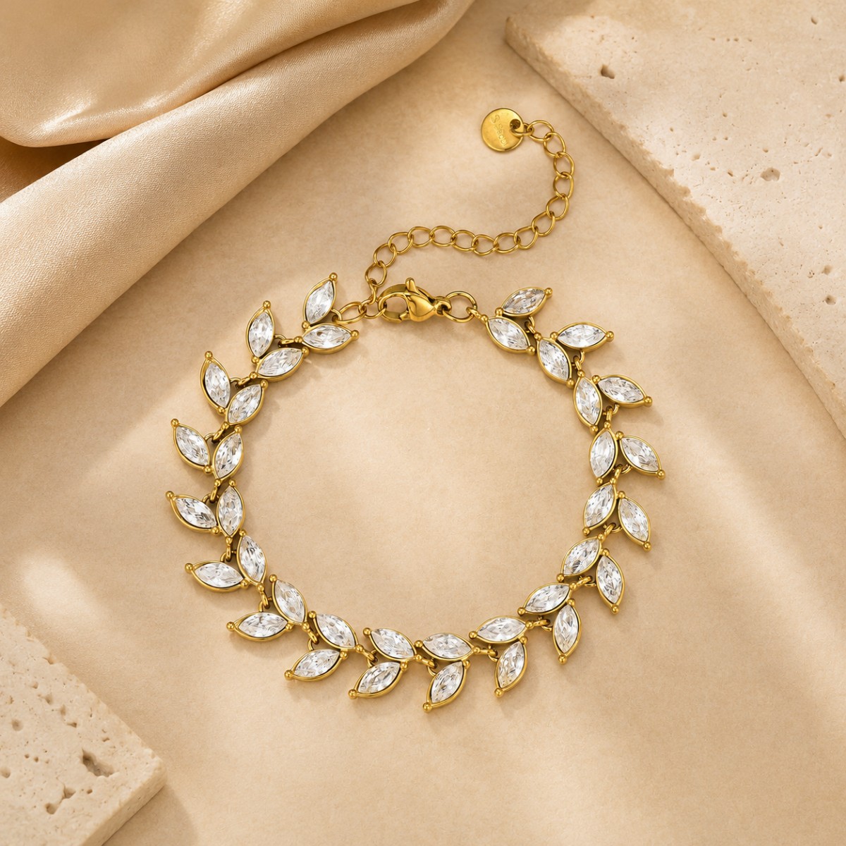 Gold Crystal Leaf Bracelet displayed in a jewelry setting