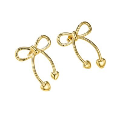 Gold stainless steel bow heart earrings on white background