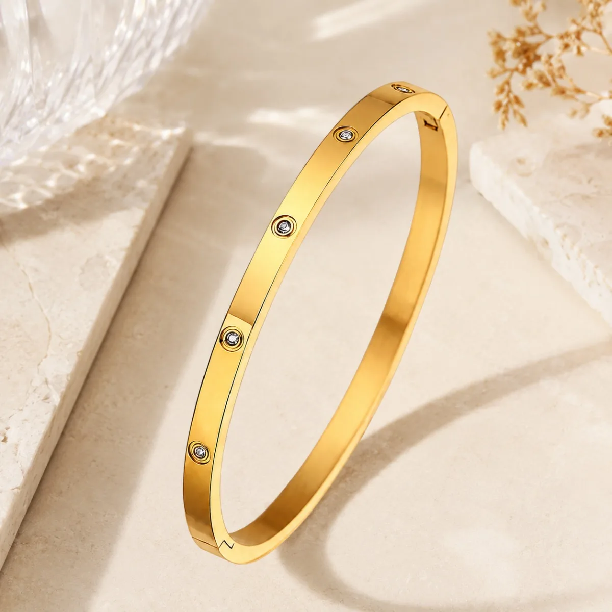 gold crystal stud bangle on white background
