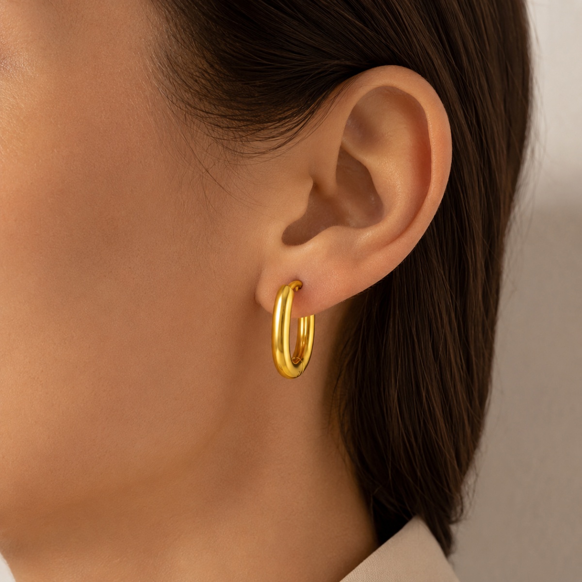 gold chunky hoop earrings on white background