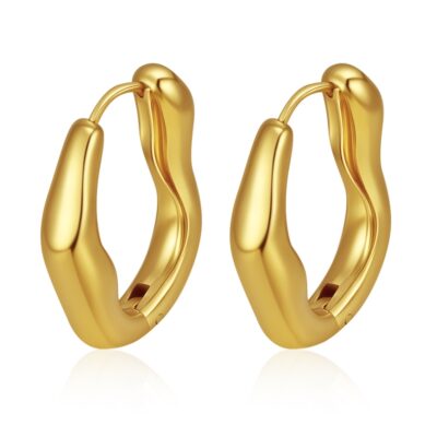 gold oval hoop earrings on white background