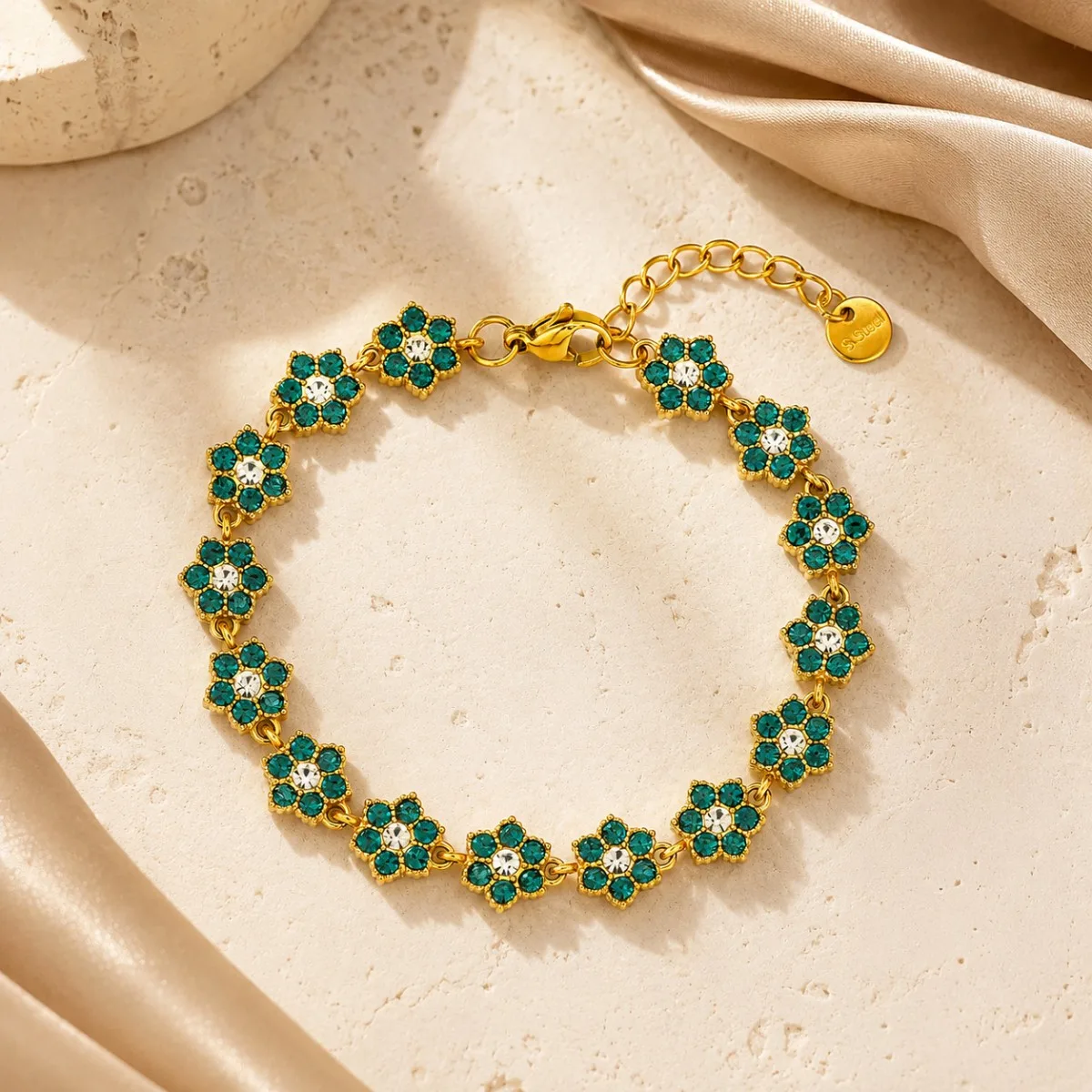 Close-up detail of green floral crystal settings on Crystal Flower Bracelet