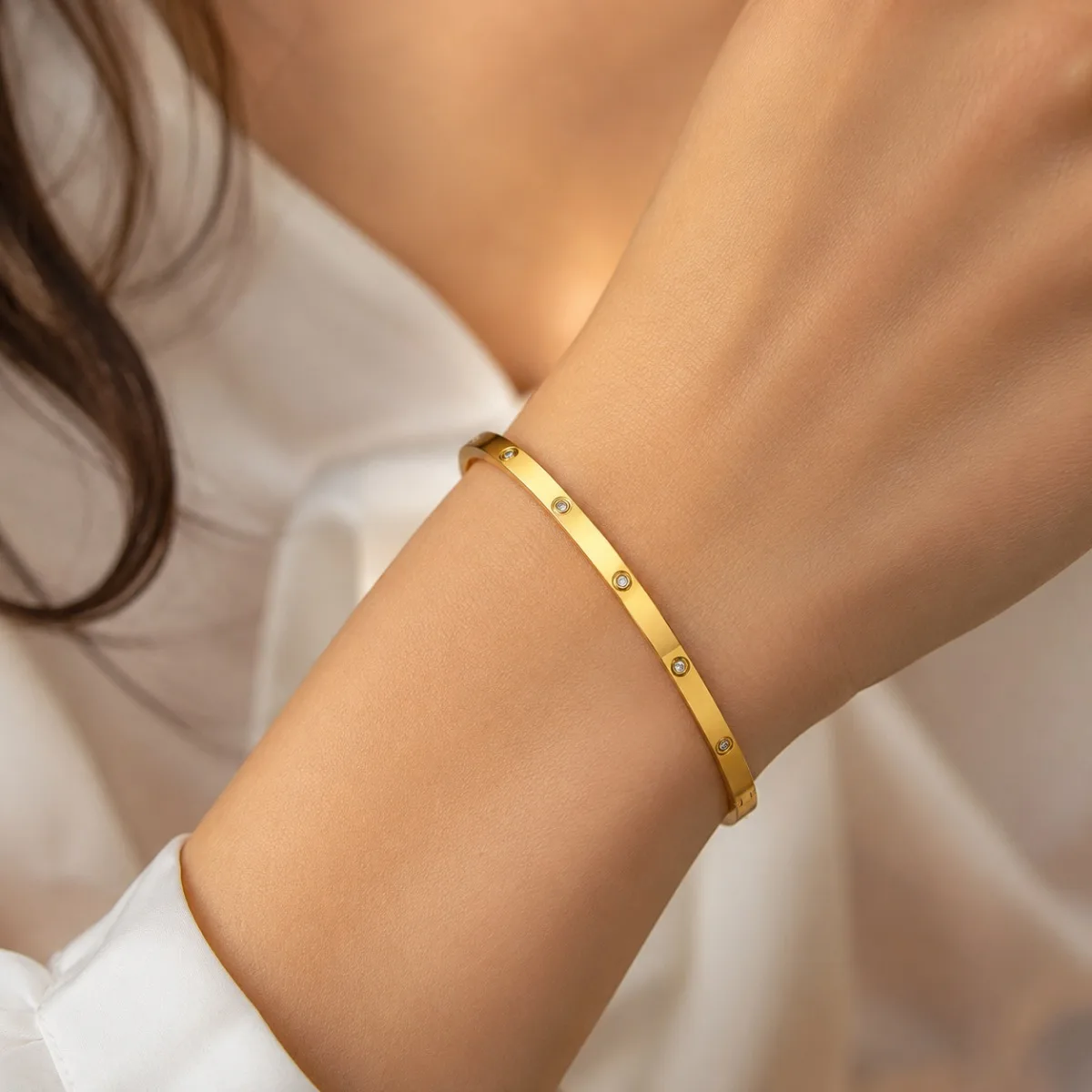 gold crystal stud bangle on white background