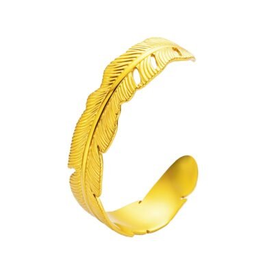 Gold stainless steel feather bangle on white background
